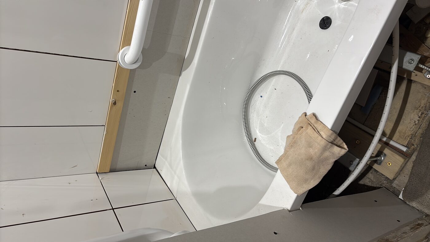 Bath panel off — underside of bath and subfloor accessed