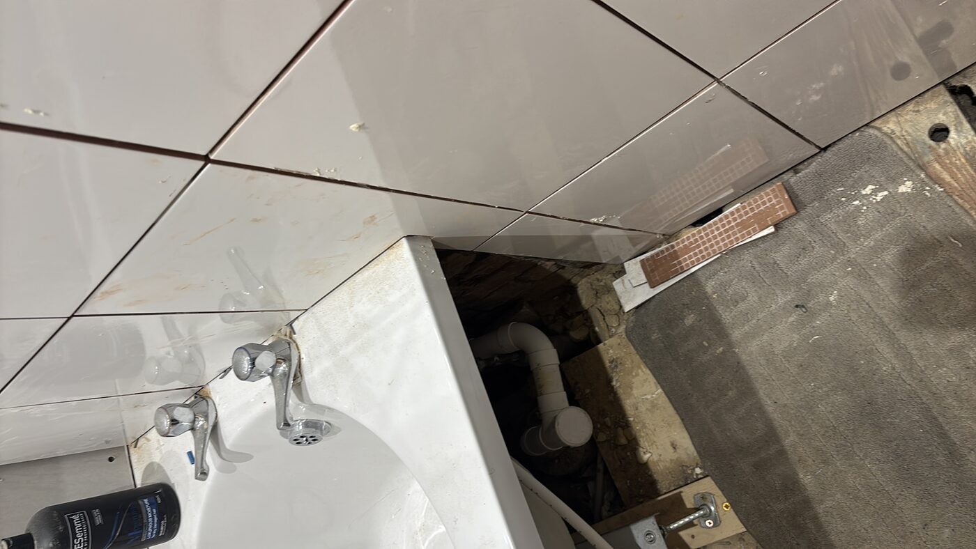 Basin area inspected — pipework and waste connections checked
