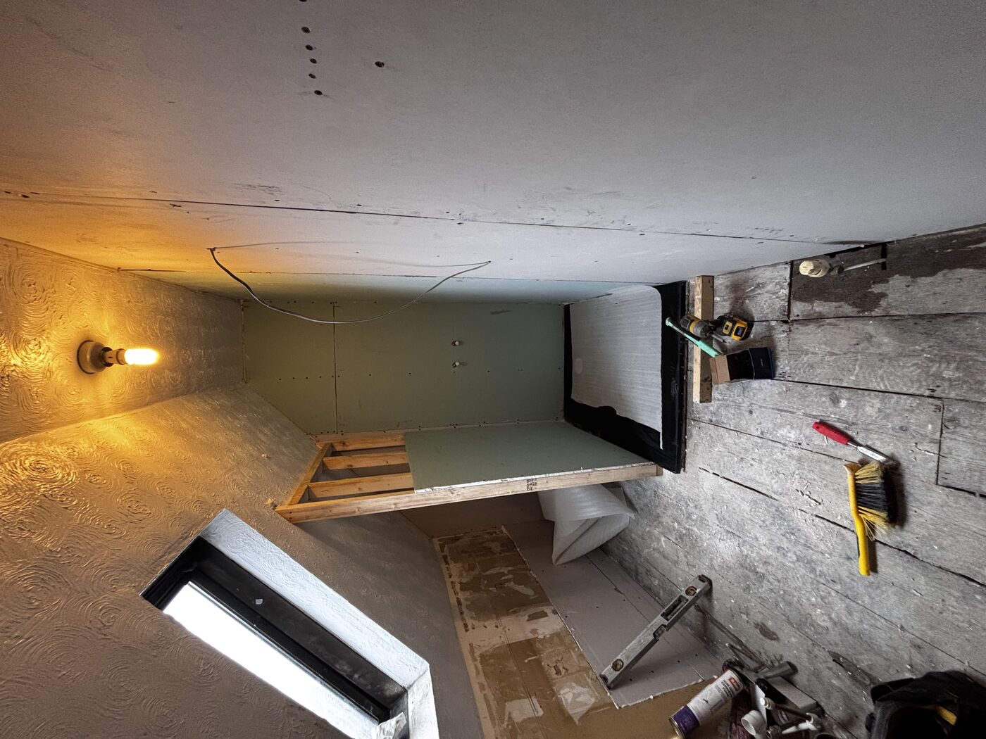 Stud wall framed, aqua panels fitted inside shower enclosure, plumbing rough-in underway