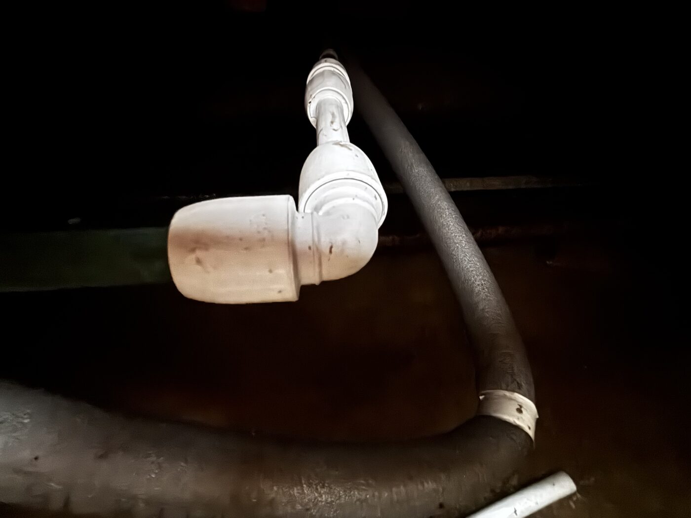 New push-fit elbow fitted under the floor — pipe cut back to good copper