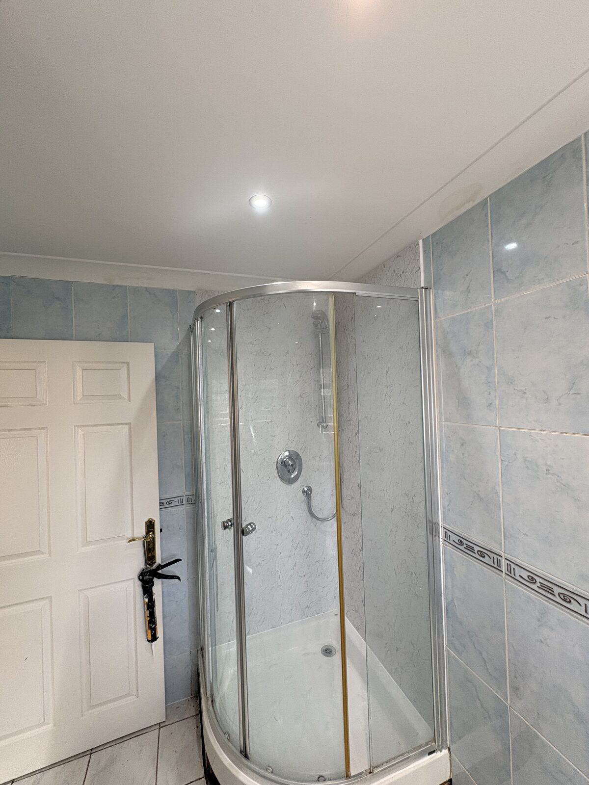 Wider bathroom view of the completed shower-panel upgrade in Ryde