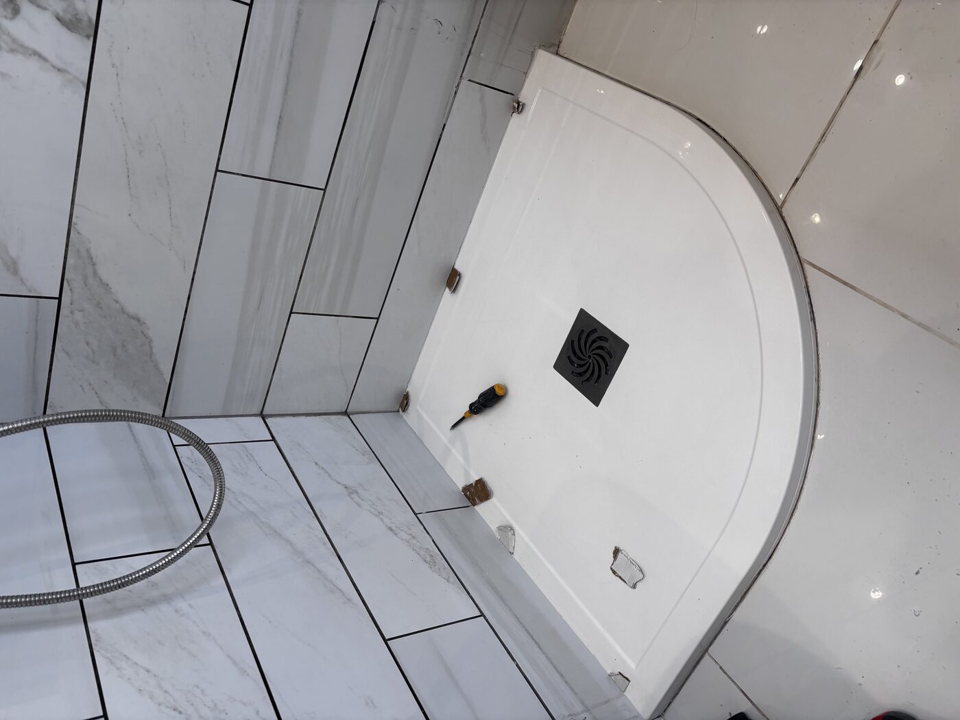 Old tray out, new quadrant tray positioned and clipped in place
