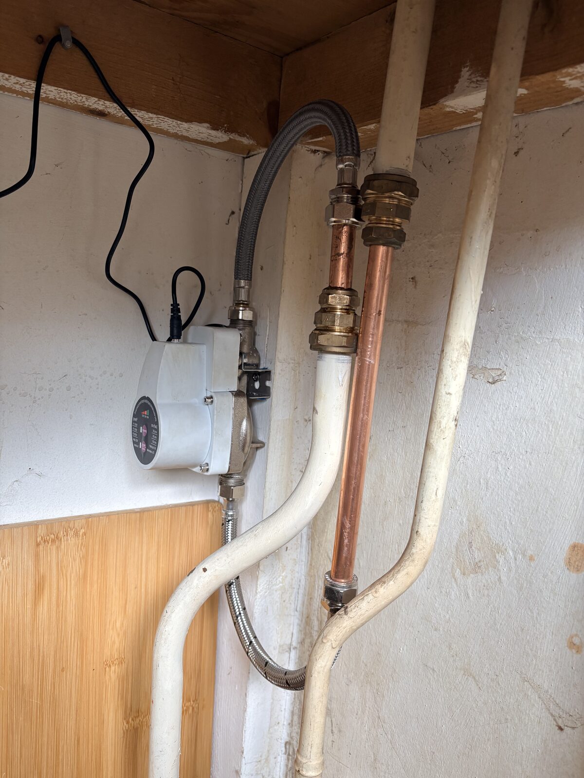 Installed water pressure booster pump with its pipe connections